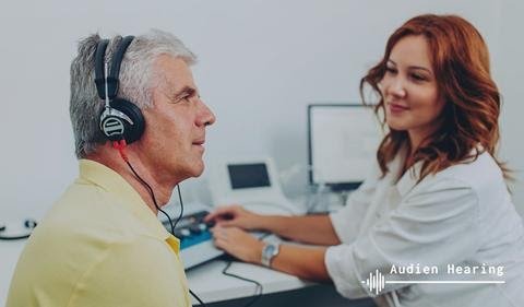 Healthcare provider performing Pure Tone Testing